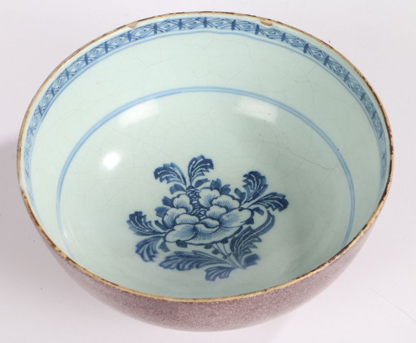 A mid 18th Century English Delft bowl, circa 1740, with a manganese outer and internally with a - Image 2 of 2