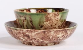 An 18th Century Whieldon type bowl and saucer, in tortoiseshell glaze, the saucer 11.5cm diameter