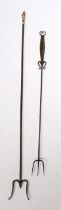 An 18th Century steel toasting fork, with three prongs and a flattened handle with etched design,