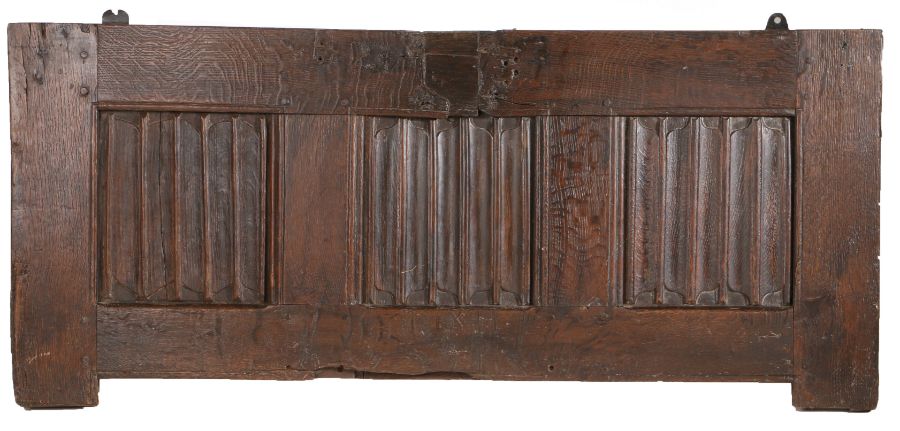 A 17th Century oak coffer front panel, with three linen fold panels set to the front, 129cm wide,