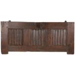 A 17th Century oak coffer front panel, with three linen fold panels set to the front, 129cm wide,