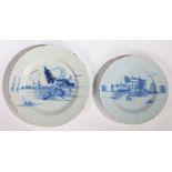 Two 18th Century Delft plates, both painted in blue, one with a farm and windmills, 27cm diameter