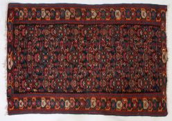 A Kuba slit tapestry Kilim, Caucasian, set with floral guls with a repeating border, red orange