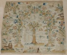 An 18th Century needlework fragment, depicting Adam and Eve in the Garden of Eden centred by the