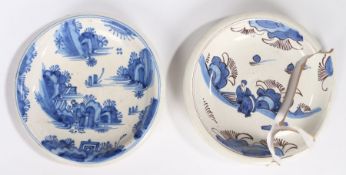 Two 18th Century English Delft dishes, both with an Oriental scene and rocky landscape, one AF, 22cm