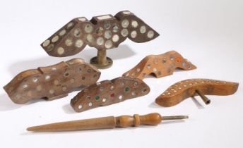 A collection of five French lark decoys, each stylistically shaped in the outline of birds, 24cm