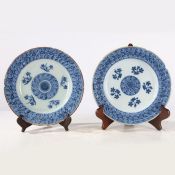 Two mid 18th Century delft plates, decorated with floral sprigs, 23cm diameter, (2)