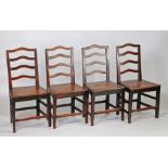 A set of four George III oak and elm ladder back chairs, circa 1790, each with a a row of four