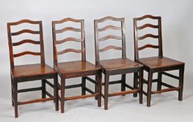 A set of four George III oak and elm ladder back chairs, circa 1790, each with a a row of four