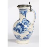 A 17th Century Delft  jug or ewer, circa 1660-80, painted in blues with rocks and flowers capped