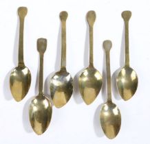 A collection of six George III gilded spoons, with worn bowl and stems with flattened ends, (6)