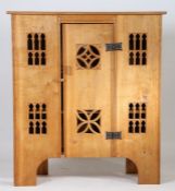 A Gothic style oak boarded press cupboard or aumbry, in the 16th Century manner, the rectangular top