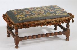 An 18th Century walnut and wool work stool, the wool work top with a bird in a pear tree and a fox