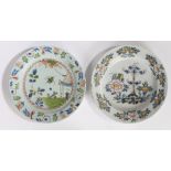 Two 18th Century English Delft chargers, the first decorated with red, blue and green showing a