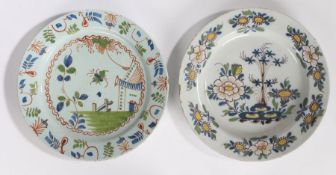 Two 18th Century English Delft chargers, the first decorated with red, blue and green showing a