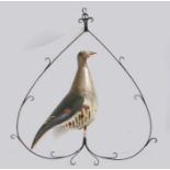 A French toleware game sign, with a painted bird within an arched frame, 60cm wide, 69cm high