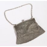 Continental silver evening bag, with chain link strap and silver clasp above a chainmail mesh