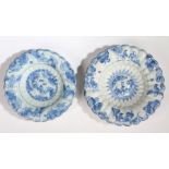 Two 17th Century Dutch Delft lobed dishes, both with a central Oriental figural scene and borders,