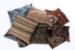 A collection of cushions made from rug fragments