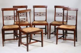 A set of six 19th Century Suffolk ash and elm dining chairs, each with an arched rail above four