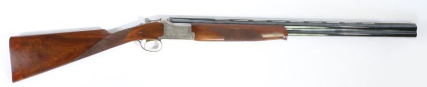 A Browning 525 20 bore multi-choke boxlock over and under shotgun, with 28" barrels and scroll
