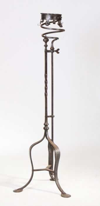 A large iron candle holder, the collar top above a scroll apron on twist column and arched - Image 2 of 2