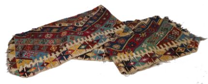 An Anatolian Kilim, with a three central guls with bands of diamond lozenges surrounding set with