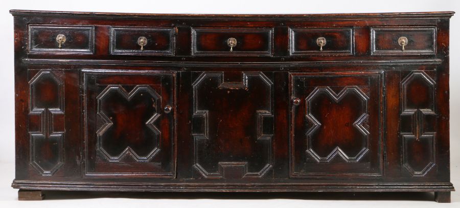 A William and Mary oak dresser, circa 1690, the rectangular top above three drawers and two cupboard