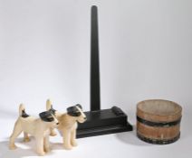 A pair of porcelain model dogs, Terriers, together with a modern charger stand in the 19th Century