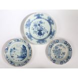 Three 18th Century Delft chargers, the first with an Oriental scene and a phoenix flying above a