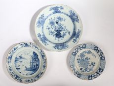 Three 18th Century Delft chargers, the first with an Oriental scene and a phoenix flying above a