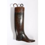 A 19th Century shoe shop/cobblers sign, carved in the form of a boot with a loop and hook to the