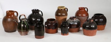 A collection of treacle and brown glazed pots and jugs, of various forms (11)