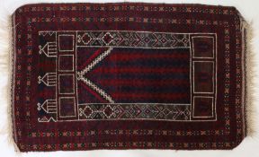 A Turkmen prayer rug, Central Asia, with a Kochak style central design surrounded by a chevron and