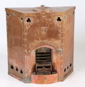 A Victorian Gothic Revival copper pitha stove, the top with a lid above the riveted body with Gothic