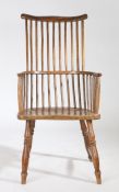 A late 18th Century ash and elm comb back Windsor chair, circa 1800-1820, West Country, the curved