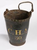 A George III leather fire bucket, with strap handle above a tapering body with C.H.A. 30 in