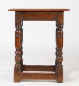 A 17th Century style oak joint stool, the rectangular top above frieze with channel moulding above