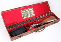 An Army and Navy 12 bore sidelock side by side non-ejector shotgun, with 30" barrels, foliate and