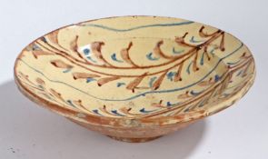 A large 19th Century French bowl, with reed bands in blue and brown, crack, 30.5cm diameter