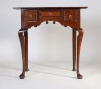 A George III oak and chequer strung lowboy, the rectangular top with a crossbanded and chequer