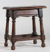 A 17th Century style oak joint stool, the rectangular top above frieze with channel moulding and a