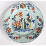 An 18th Century English Delft plate, circa 1750, Lambeth, with a parrot on a branch by large