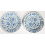 A pair of 18th Century Delft plates, circa 1740, decorated in blue with flowers, 22.5cm diameter, (