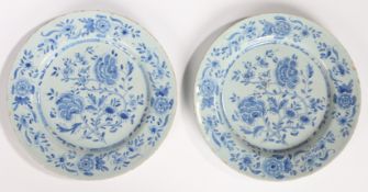 A pair of 18th Century Delft plates, circa 1740, decorated in blue with flowers, 22.5cm diameter, (