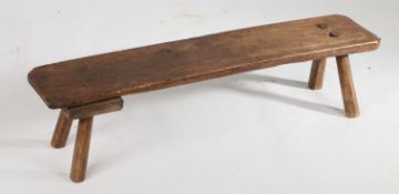 A 19th Century elm pig bench, the rectangular top above four angled chamfered legs, 103cm long, 23cm