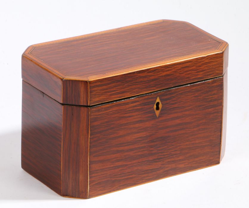 A Regency partridge wood tea caddy, the rectangular top with canted corners enclosing two lidded