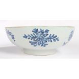 An 18th Century English Delft bowl, with a blue flower design and internal with flower sprig to