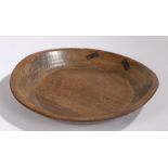 A 19th Century shallow bowl, with a rivet repair to the edge, 47cm diameter