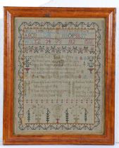 A George III named and dated sampler, with alphabet and numbers above a poem, named Charlotte Walker